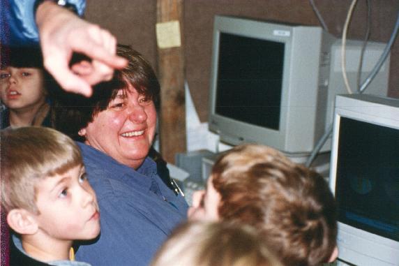 Cathy Kessinger (NCAR) with visiting school kids inside S-Pol science trailer..jpg