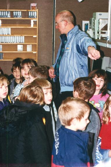 Jeff Keeler (NCAR) with visiting school kids inside S-Pol science trailer..jpg