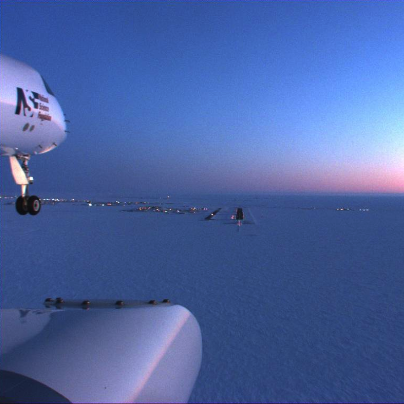 View from window of airplane at sunset.