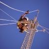 Engineer working at the top of a tower.