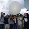 Students with weather balloon in Hawaii.