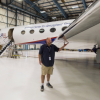 Scientist in front of an aircraft.