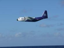 NSF/NCAR C-130 off the coast of Christmas Island for the PASE project